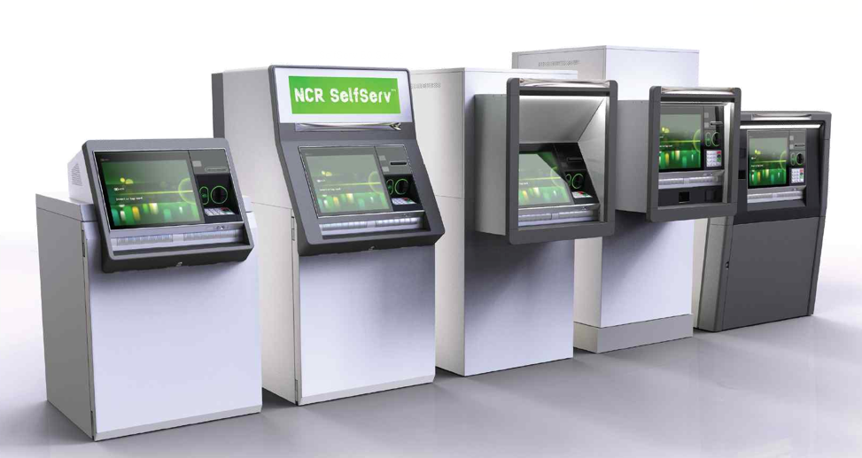 Image of several ATMs and ITMs with green screens lined up on a wall